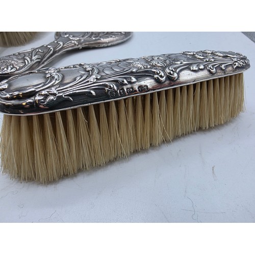 41 - A sterling silver mounted travel dressing table set in blue velvet lined leather covered box, by Hor... 