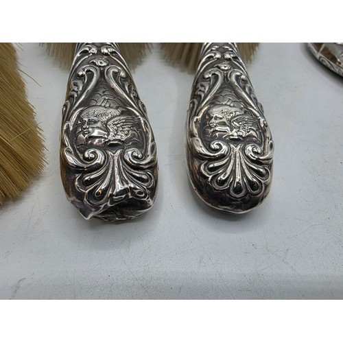 41 - A sterling silver mounted travel dressing table set in blue velvet lined leather covered box, by Hor... 