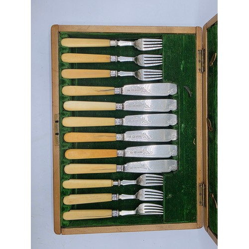 42 - A sterling silver and composite handled boxed 12 person fish knives and forks. JR Birmingham 1881.