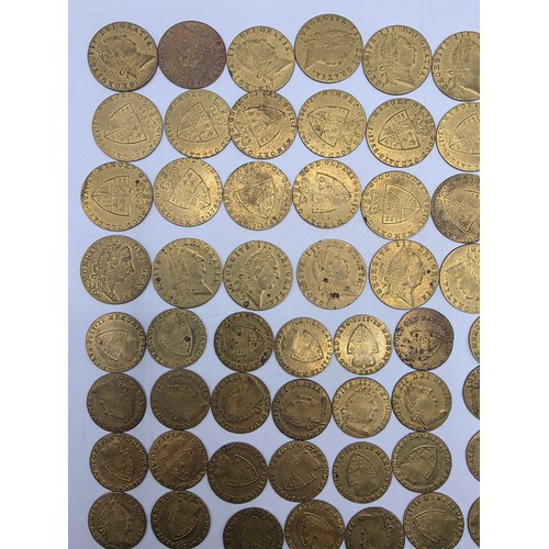 126 - A collection of George III half and full guinea spade gaming tokens.