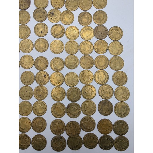126 - A collection of George III half and full guinea spade gaming tokens.