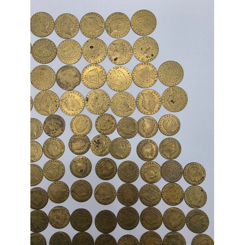 126 - A collection of George III half and full guinea spade gaming tokens.