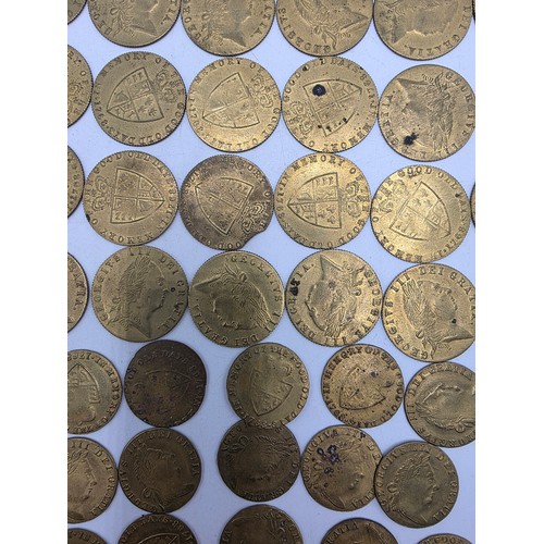 126 - A collection of George III half and full guinea spade gaming tokens.