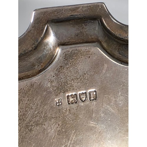 45 - A sterling silver card tray or salver with pie crust rim raised on three hoof feet. 26cm (d). By Jos... 