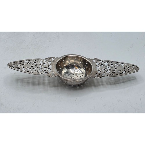 56 - A collection of white metal beakers and a Dunhill white metal engine turned cigarette lighter togeth... 