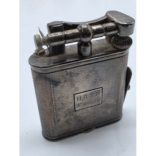 56 - A collection of white metal beakers and a Dunhill white metal engine turned cigarette lighter togeth... 