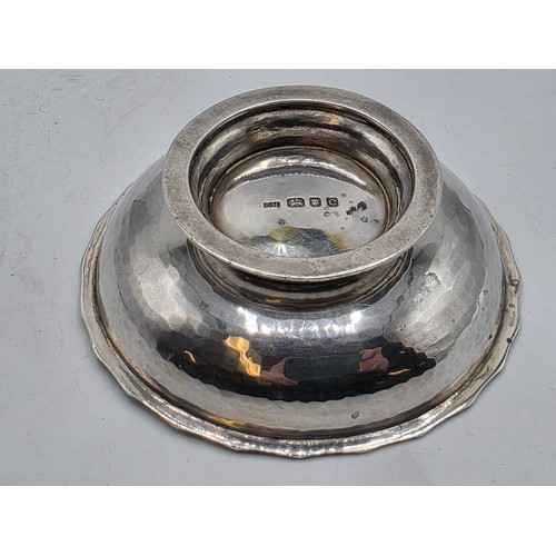 48 - A sterling silver small footed bowl with plannished decoration, GF London 2002. 141g