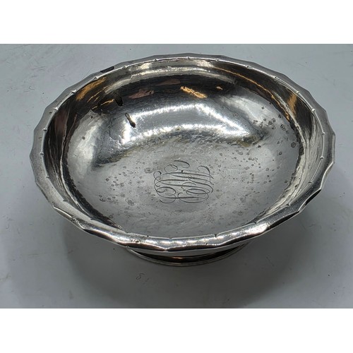 48 - A sterling silver small footed bowl with plannished decoration, GF London 2002. 141g