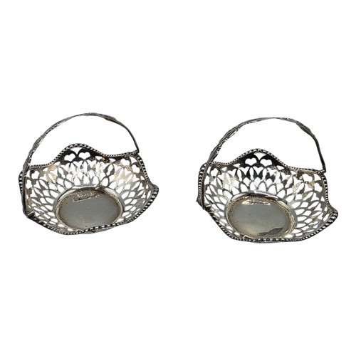 49 - A pair of swing handled miniature sterling silver pierced baskets together with a Scandinavian silve... 