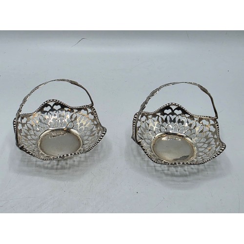 49 - A pair of swing handled miniature sterling silver pierced baskets together with a Scandinavian silve... 