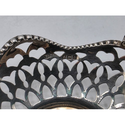 49 - A pair of swing handled miniature sterling silver pierced baskets together with a Scandinavian silve... 