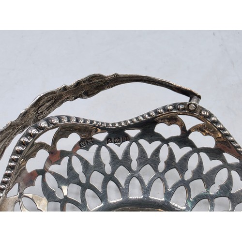 49 - A pair of swing handled miniature sterling silver pierced baskets together with a Scandinavian silve... 