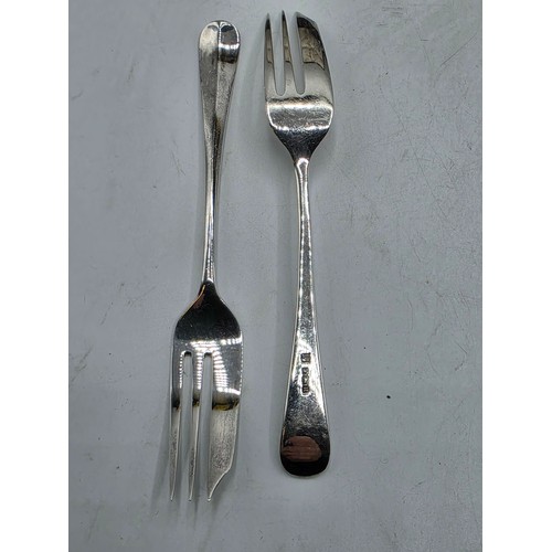 55 - A boxed set of sterling silver cake forks together with a boxed sterling silver christening spoon an... 