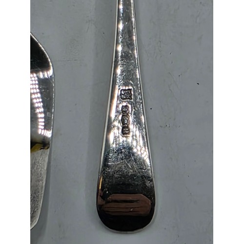 55 - A boxed set of sterling silver cake forks together with a boxed sterling silver christening spoon an... 