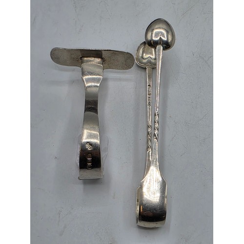 55 - A boxed set of sterling silver cake forks together with a boxed sterling silver christening spoon an... 