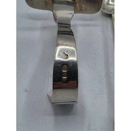 55 - A boxed set of sterling silver cake forks together with a boxed sterling silver christening spoon an... 