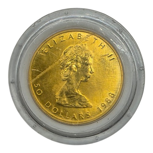 59 - A Canadian Fine one ounce 999.99 24ct gold 50 dollar 1988 Elizabeth II maple leaf coin in Perspex ca... 