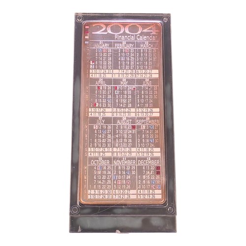 52 - A fine silver ingot Swiss Presentation metals and commodities calendar 2004. In Perspex case. states... 