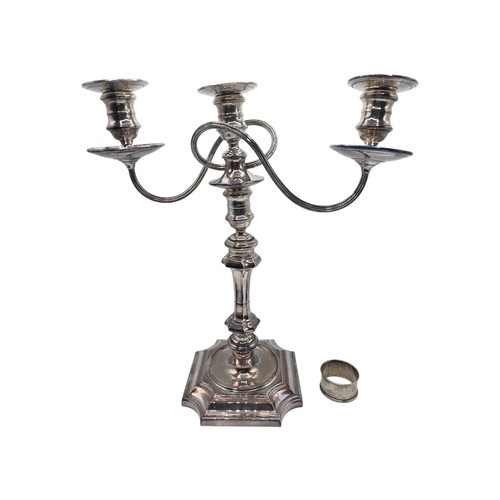 35 - A silver plated table candelabra on square cantered stepped base together with a set of steak knives