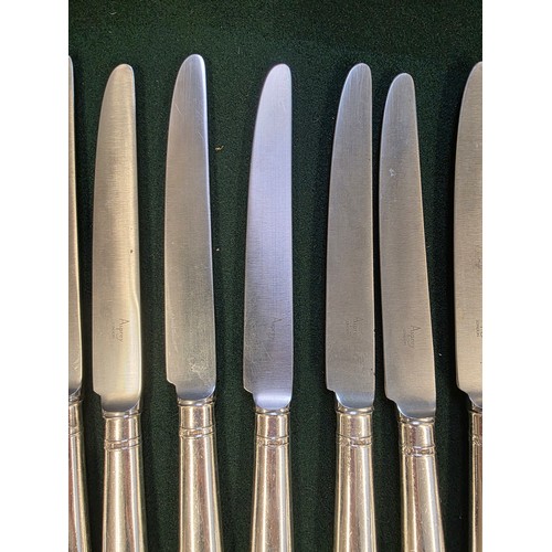 32 - A collection of sterling silver and white metal handled knives, two of the sets by Asprey's .