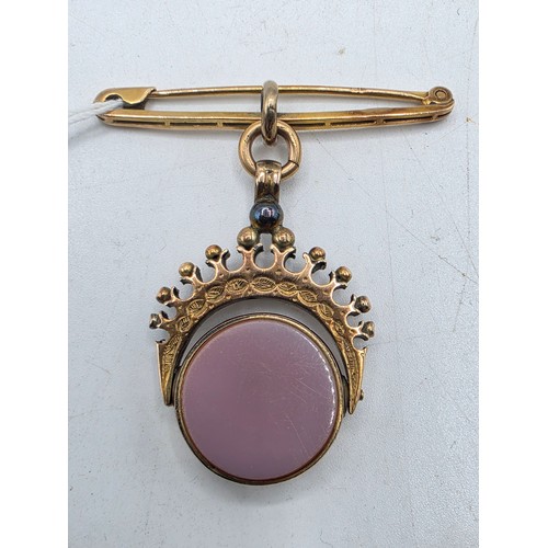 252 - Unmarked yellow metal swivel watch fob with bloodstone panel on 9 ct gold pin brooch, 6.6 g