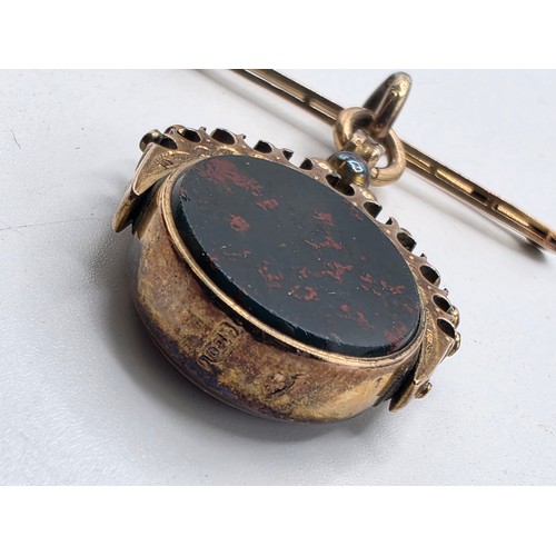 252 - Unmarked yellow metal swivel watch fob with bloodstone panel on 9 ct gold pin brooch, 6.6 g