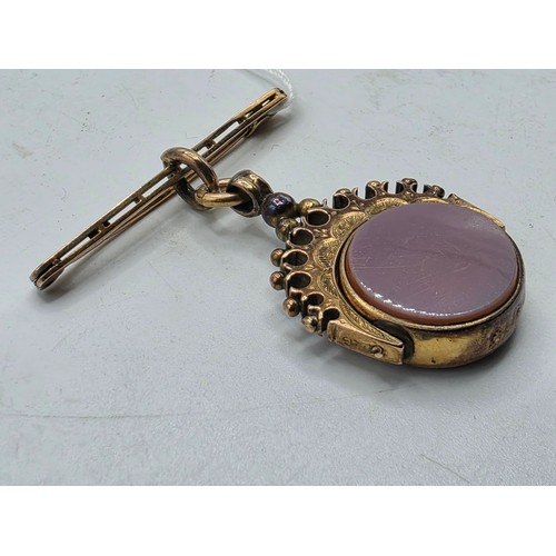 252 - Unmarked yellow metal swivel watch fob with bloodstone panel on 9 ct gold pin brooch, 6.6 g