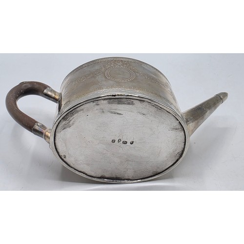 59 - A sterling silver teapot with chased swag and ribbon decoration by IW London 1782 with similar decor... 