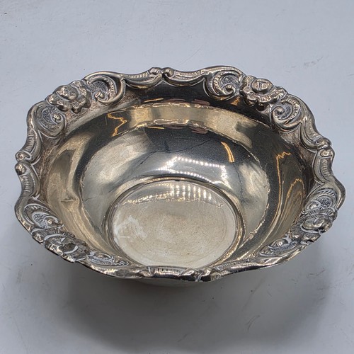 66 - Two sterling silver pierced dishes together with one small sterling silver bowl, various dates and m... 
