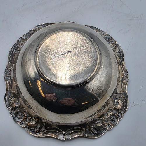 66 - Two sterling silver pierced dishes together with one small sterling silver bowl, various dates and m... 