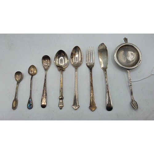 69 - A sterling silver tea strainer together with sterling silver and white metal cutlery items, various ... 