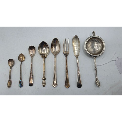 69 - A sterling silver tea strainer together with sterling silver and white metal cutlery items, various ... 