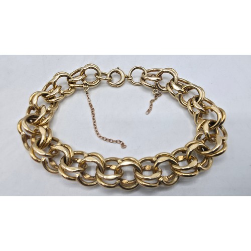 3 - A 9ct gold double fancy link bracelet, 21 cm, 37.7g