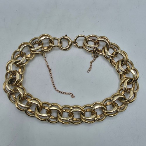 3 - A 9ct gold double fancy link bracelet, 21 cm, 37.7g