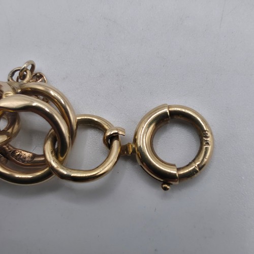 3 - A 9ct gold double fancy link bracelet, 21 cm, 37.7g