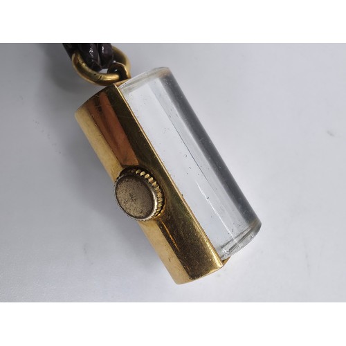 76 - A yellow metal pendant watch by Cord with black rectangular face with Arabic markers marked Asprey, ... 