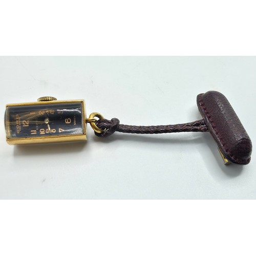 76 - A yellow metal pendant watch by Cord with black rectangular face with Arabic markers marked Asprey, ... 