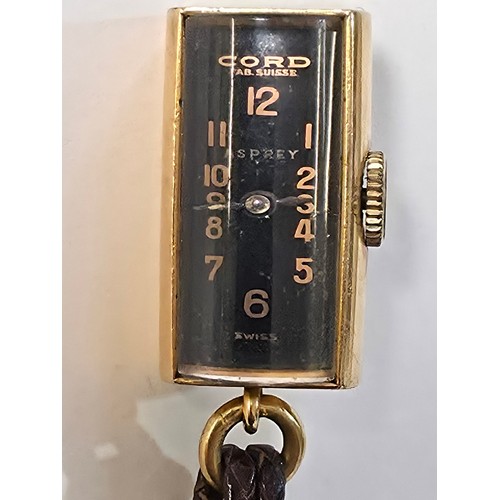 76 - A yellow metal pendant watch by Cord with black rectangular face with Arabic markers marked Asprey, ... 