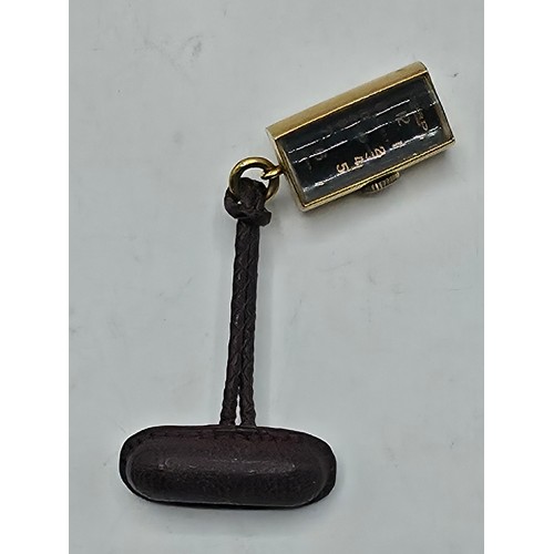 76 - A yellow metal pendant watch by Cord with black rectangular face with Arabic markers marked Asprey, ... 