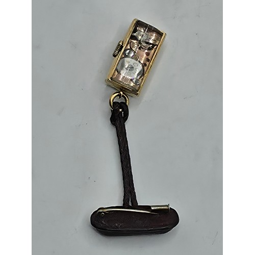 76 - A yellow metal pendant watch by Cord with black rectangular face with Arabic markers marked Asprey, ... 