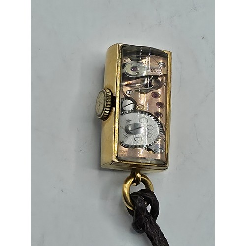 76 - A yellow metal pendant watch by Cord with black rectangular face with Arabic markers marked Asprey, ... 