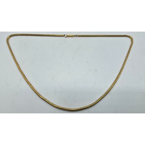 79 - An unmarked yellow metal snake link necklace 42 cm, 8.3 g