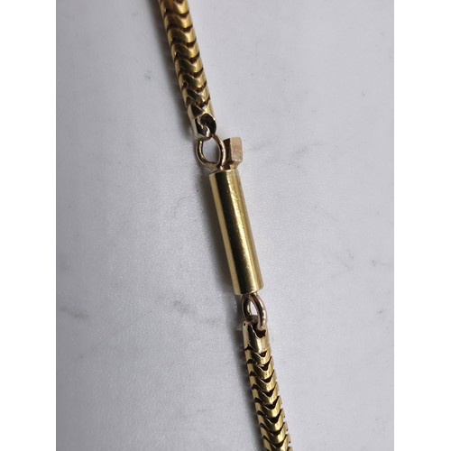 79 - An unmarked yellow metal snake link necklace 42 cm, 8.3 g