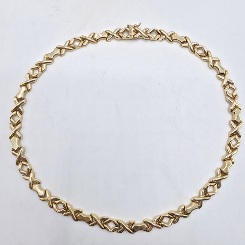 38 - A 9ct gold flat fancy link necklace. 43cm. 20g