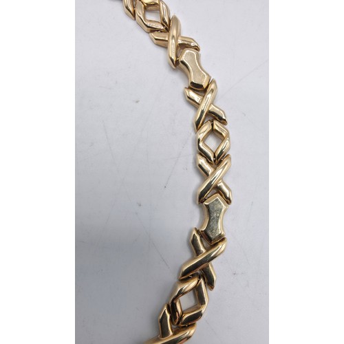 38 - A 9ct gold flat fancy link necklace. 43cm. 20g