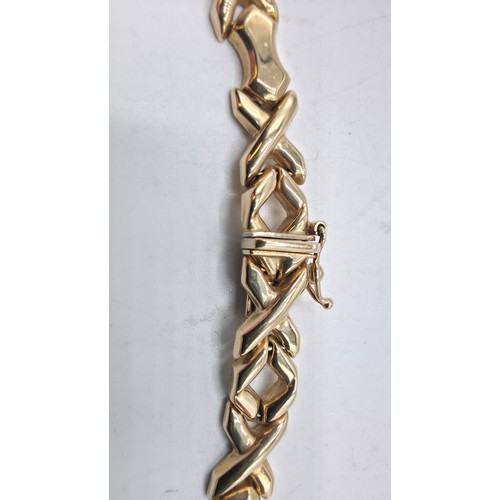 38 - A 9ct gold flat fancy link necklace. 43cm. 20g