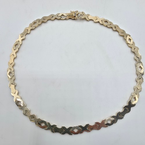 38 - A 9ct gold flat fancy link necklace. 43cm. 20g
