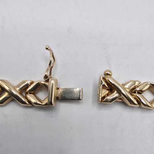 38 - A 9ct gold flat fancy link necklace. 43cm. 20g