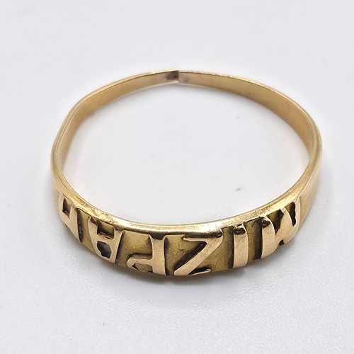48 - An 18ct gold band. 1g. Marked to band  'Mizpah'
