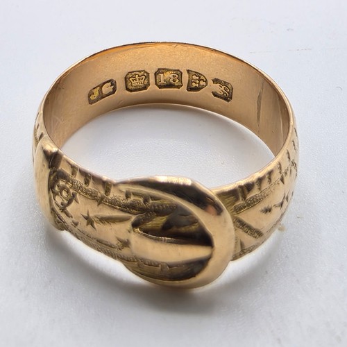 47 - An 18ct gold buckle ring. Size N. 5.6g
